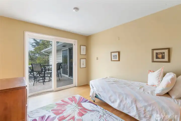 Second bedroom with direct access to back deck.