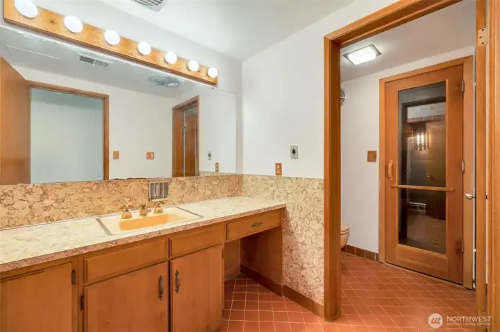 Lower 3/4 bathroom with Sauna door to the right