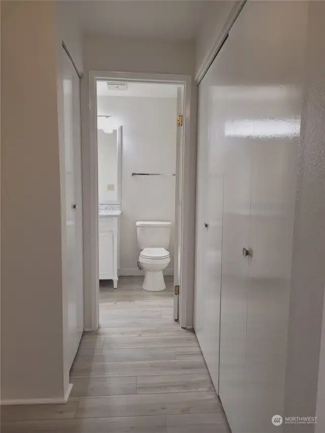Hallway to bathroom- storage closet and laundry closet along the way