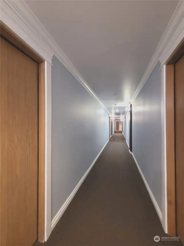 Hallway leads down towards the elevator
