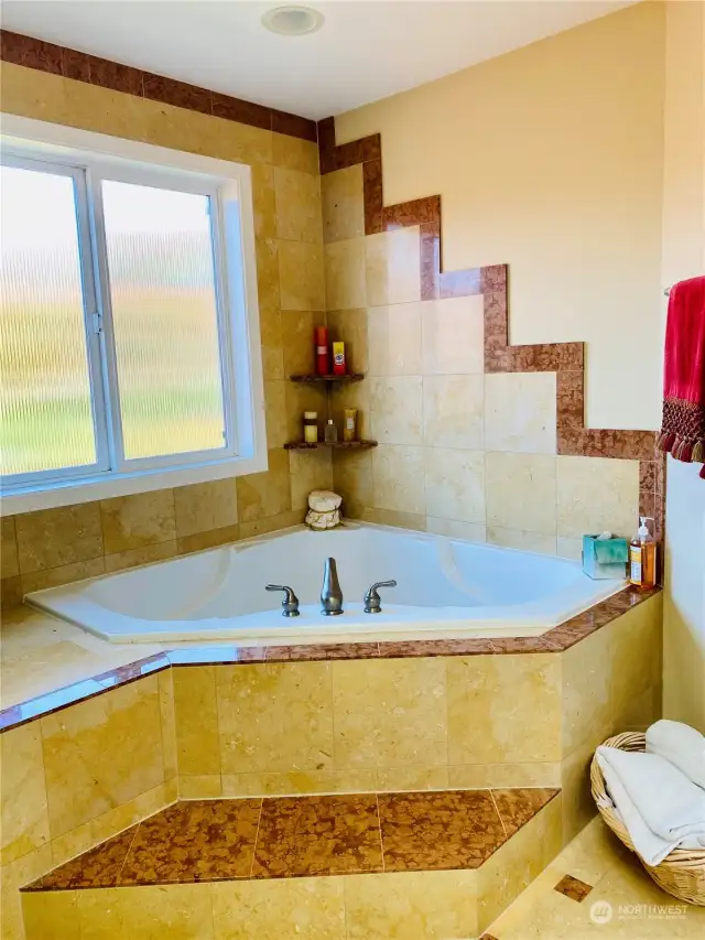 Primary bathroom large soaking tub.