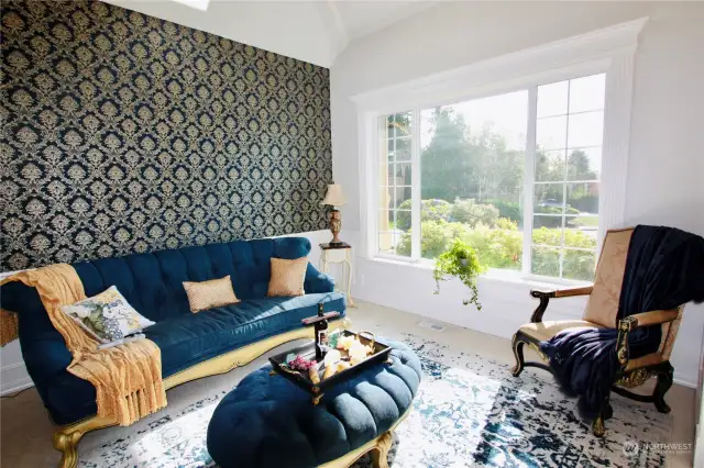 Front room with lots of natural light from large windows.