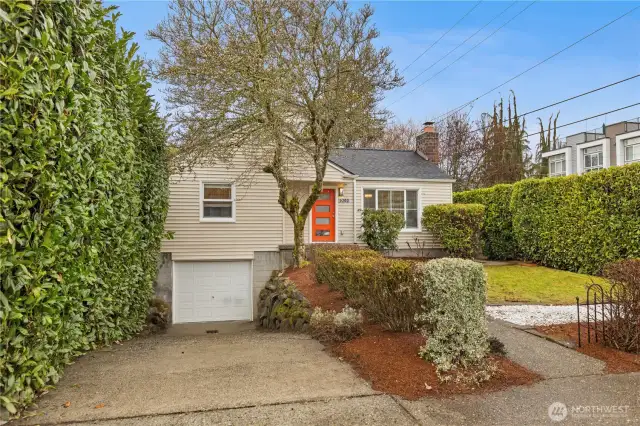 Adorable bungalow with one car garage and driveway parking