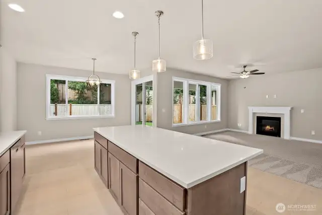 Solid surface counters with large single-level island. Home under construction, photo for illustration only.