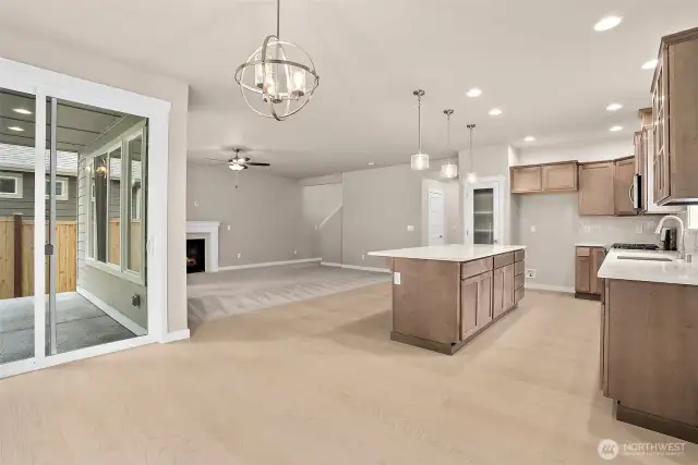 Extensive hardwood floors in entry, kitchen and dining. Home under construction, photo for illustration only.