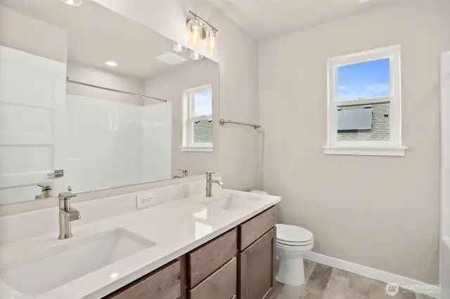 Main bathroom second level with dual sinks and quartz countertop. Home under construction, photo for illustration only.