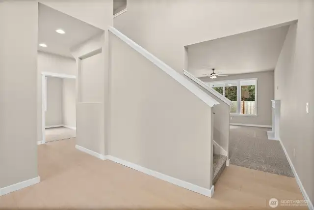 White millwork throughout including doors, windows and fireplace mantle. Home under construction, photo for illustration only.