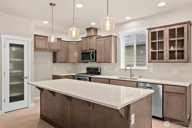 Canyon Creek Cabinets on Maple with full extension guides and soft close drawers throughout. Home under construction, photo for illustration only.