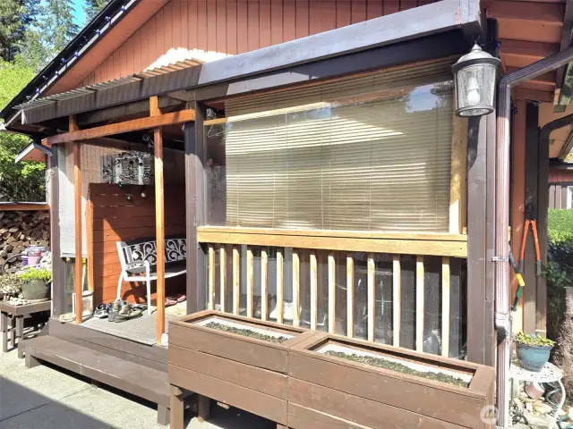 Covered side proch.  Lockbox on this door