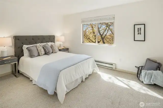 This freshly painted primary bedroom provides a peaceful atmosphere and plenty of room to unwind.