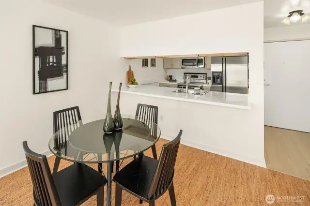 Located just off the kitchen, the dining space is ideal for hosting a game night or sharing a bite to eat.