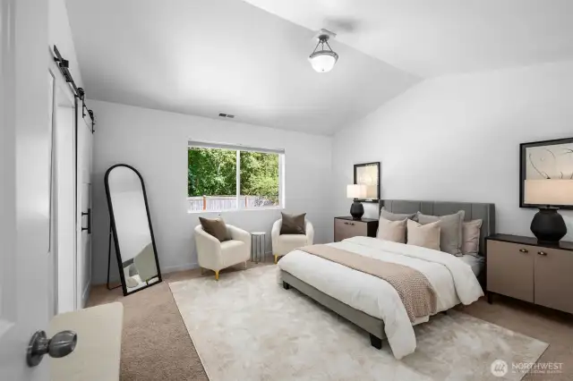 A primary suite fit for a king—or any size bedroom furniture—boasts soaring vaulted ceilings and exceptional privacy, making it a true retreat.