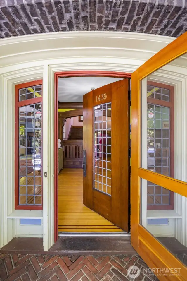 The beautifully detailed front door opens to invite you into a home filled with timeless character.