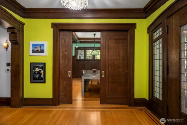 Beautiful wood doors close off the formal dining room, adding versatility to the space.