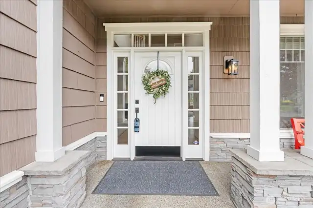 Covered Patio and beautiful entry door to the home