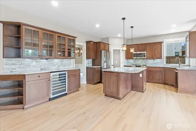 Renovated kitchen with beautiful cabinets and beverage center