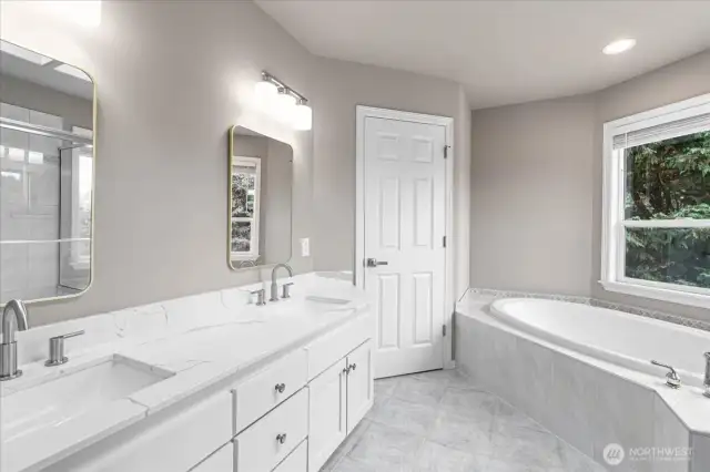 Beautifully remodeled primary bathroom with tons of natural light