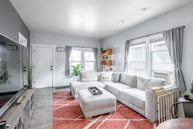 The living room space provices wonderful natural light with the large beautiful windows with ample space for entertaining.