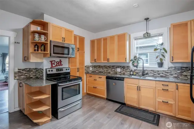 Calling all chefs! This kitchen is amazing with its flooring, ample counter space and cabinetry.