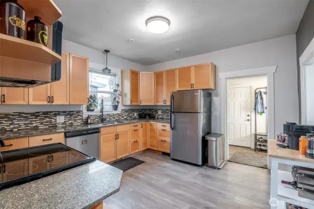 The stainless appliances make this beautiul kitchen shine.