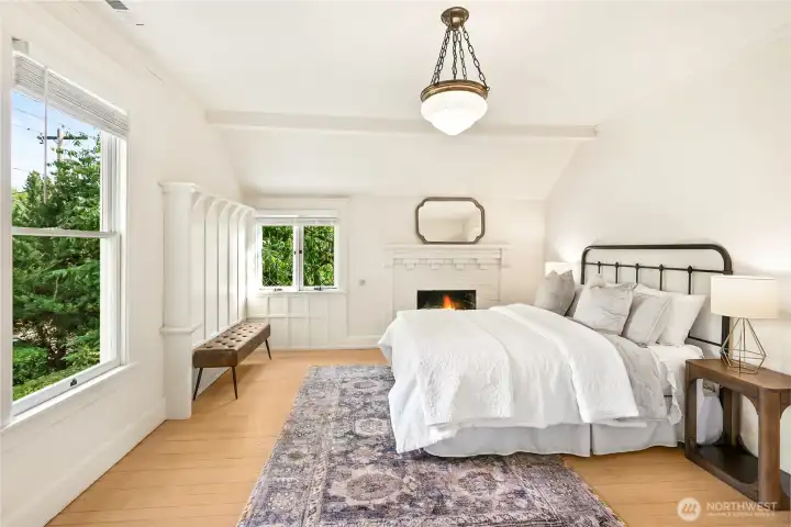 Primary is sunlit and has cool fireplace. Large updated bath with refurbished clawfoot tub and massive walk in closet.
