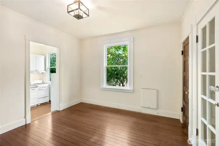 MAIN FLOOR APARTMENT : Lots of natural light. Living Room, Full kitchen, Bath, and Bedroom
