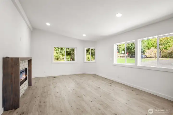 Main living area with fireplace and custom built mantle.