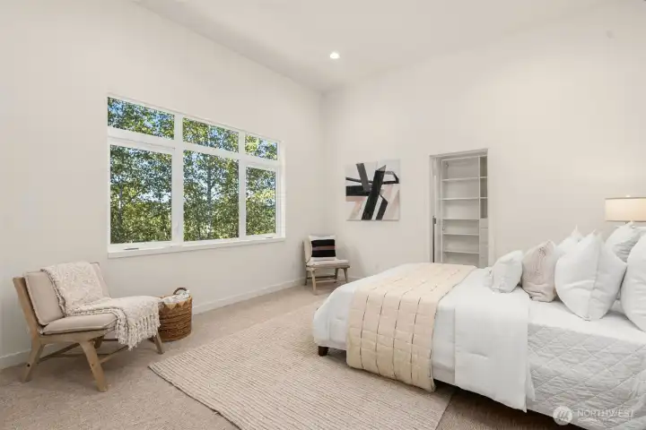 The secondary bedroom lives large, with extra space in mind for an in home