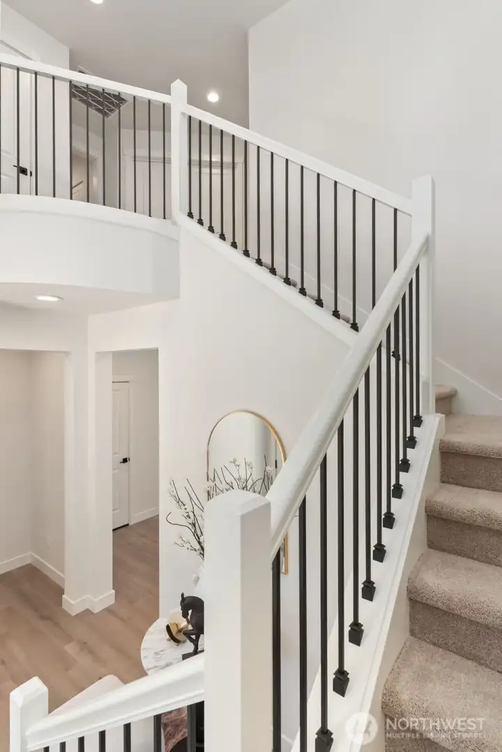 Interior photo shown is from a similar new construction home by the same builder. Fixtures, flooring, floor plan, and finishes are representative and may differ from the home currently under construction.
