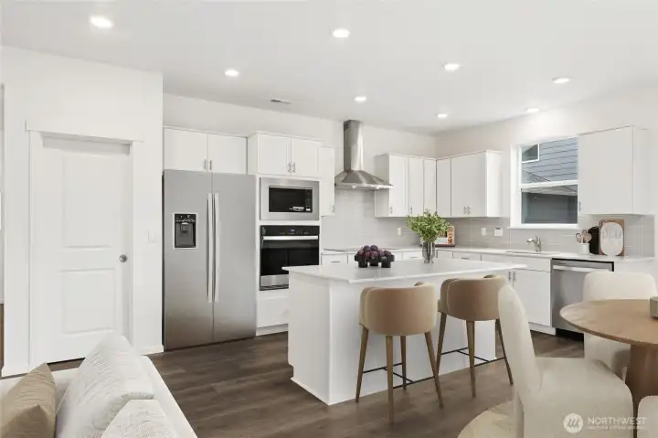 Gourmet kitchen with walk-in pantry. Virtually Staged.