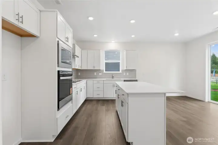 Quartz countertops & white cabients.