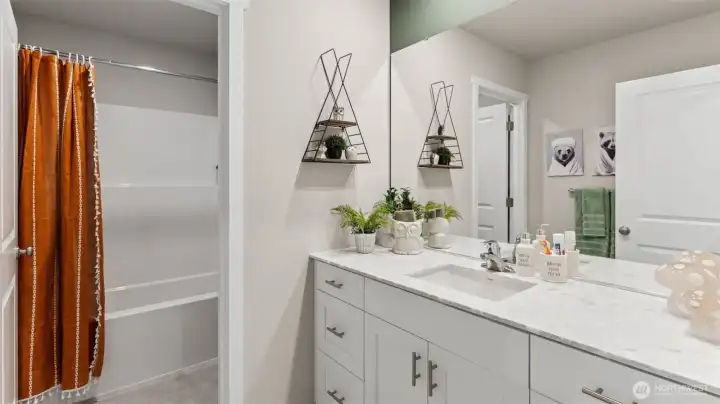 Bathroom upstairs with split door, soft close cabinet, quartz countertops. Pictures are for representational purposes only, colors and features may vary.