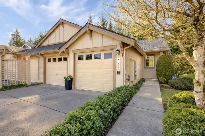 Single-level floor plan with a private two-car garage and space in the driveway for guests to park. Roofs were replaced in 2025 and exterior painting is slated for 2027.