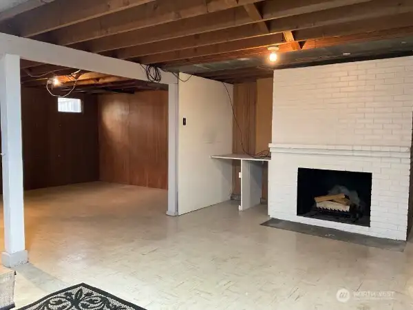 Lower Level with wood fireplace, room for pool table or whatever you need.