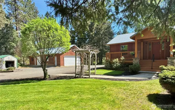 Expansive outdoor living begins at the front entry.