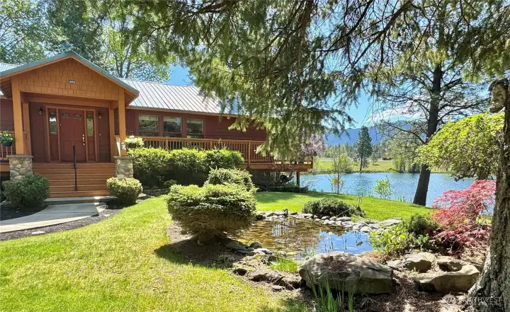 Serene front yard water feature creates a tranquil welcome.