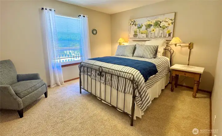 Tranquil bedroom with abundant natural light.