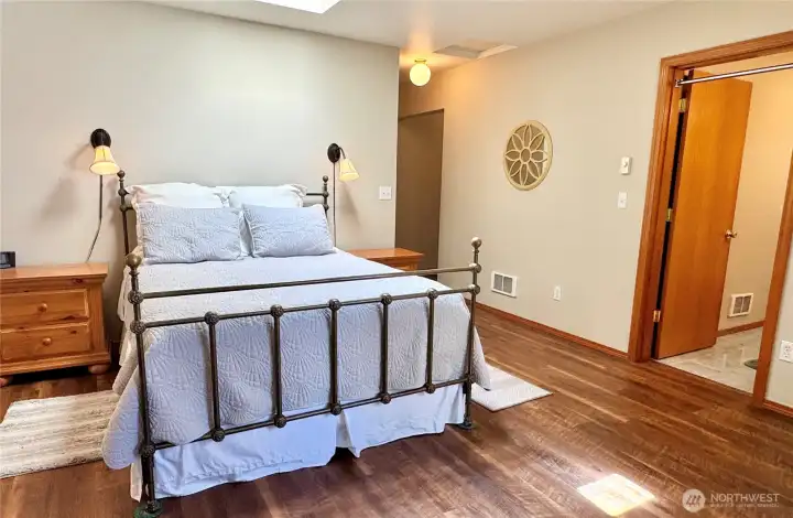 Another view of the primary bedroom with a private bath.