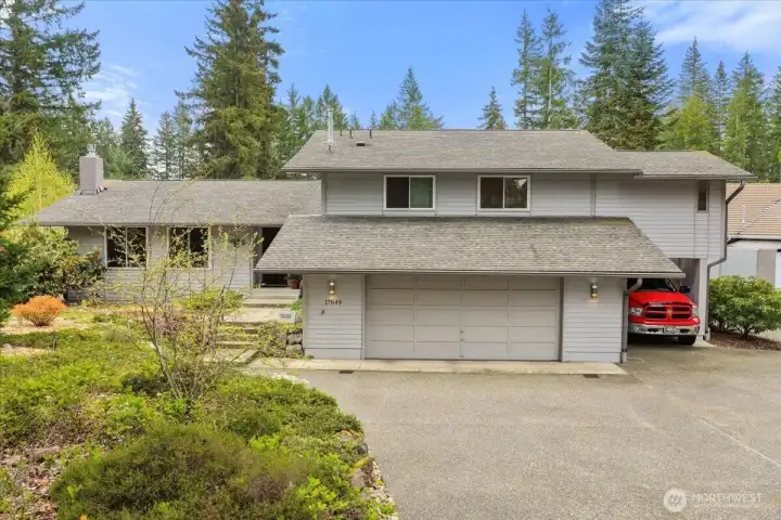 Beautiful tri-level home with 2-car garage, carport, and RV parking.