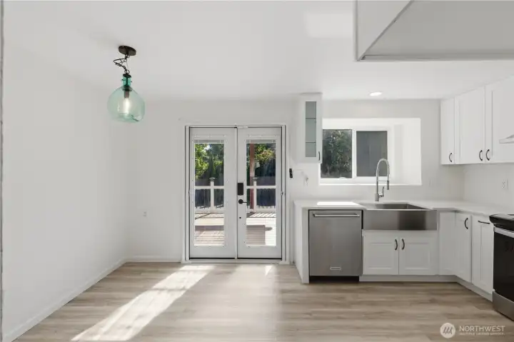 Eat in kitchen with French doors leading out to covered patio