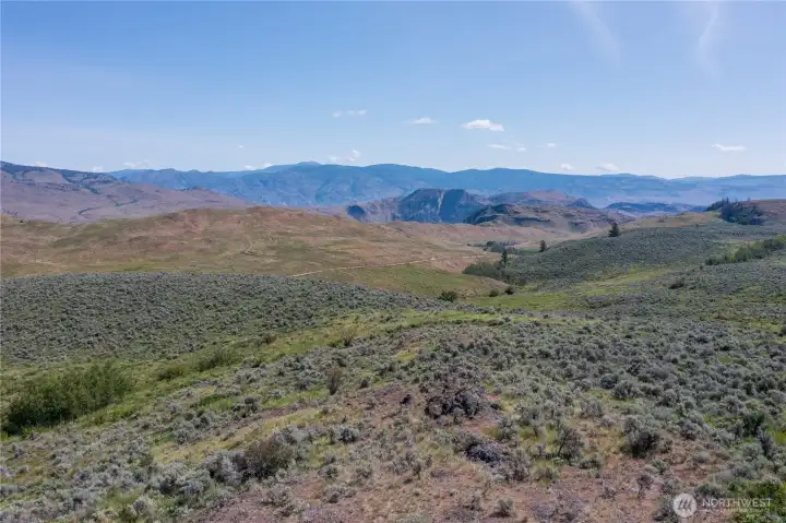 Looking Northeast from the top of the property. Canadian mountains in the horizon. Looking Northeast from the top of the property. Canadian mountains in the horizon.
