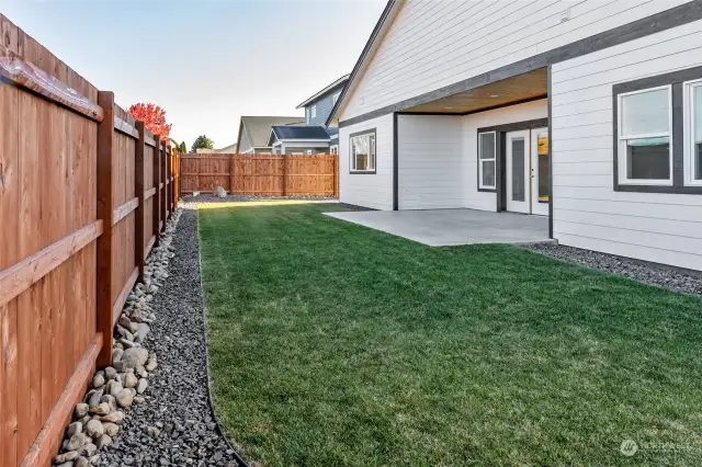 Rear yard, fully fenced, landscaped and sprinkler system installed