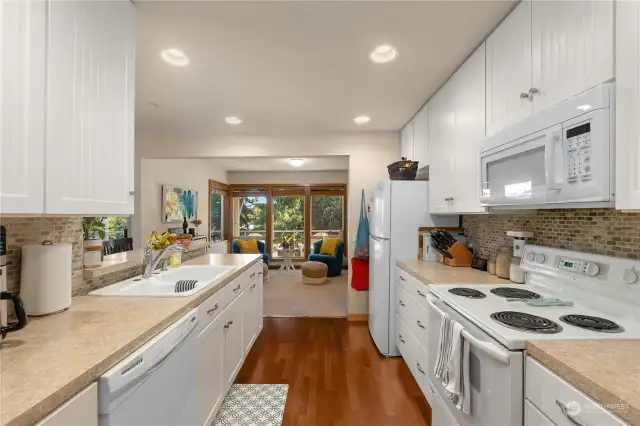 Middle Floor Unit - Kitchen opens to sitting area and out to deck