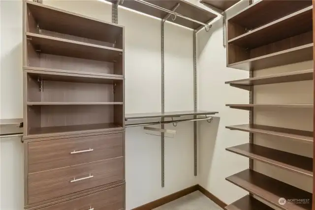 Custom walk in closet with adjustable shelving