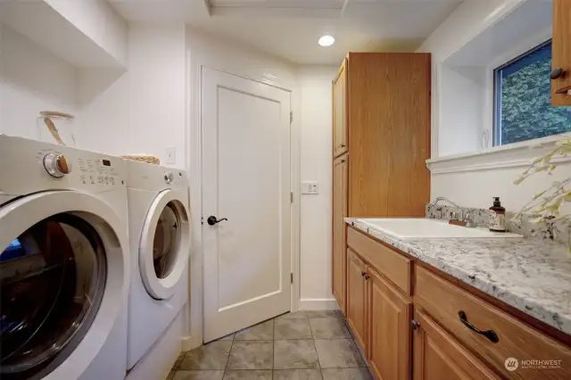 Main floor laundry room with access to double car garage.