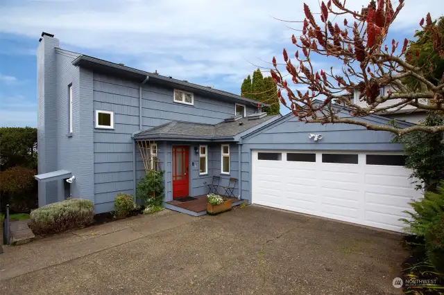 Double car garage is located on 100th, the backside of the house.