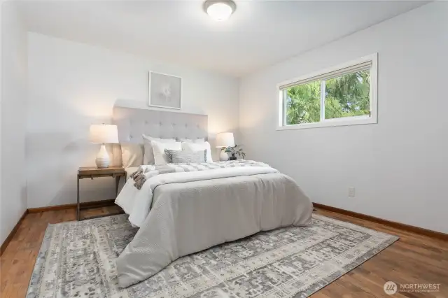Beautiful original hdwd floors in main bedroom - flooring appears to be under most carpet in home