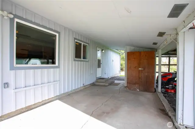 Carport w/extra storage including built in shed
