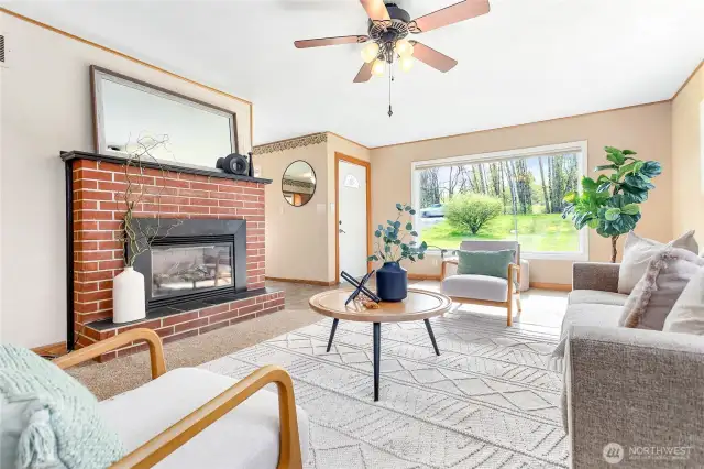 Cozy gas fireplace w/original brick surround