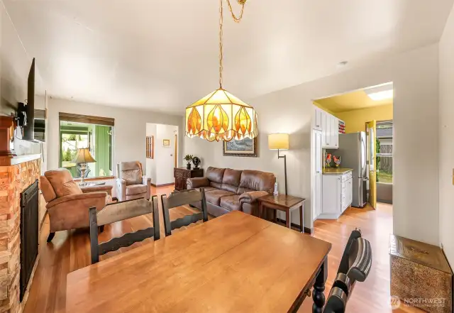 View form dining corner towards the entry and the kitchen.